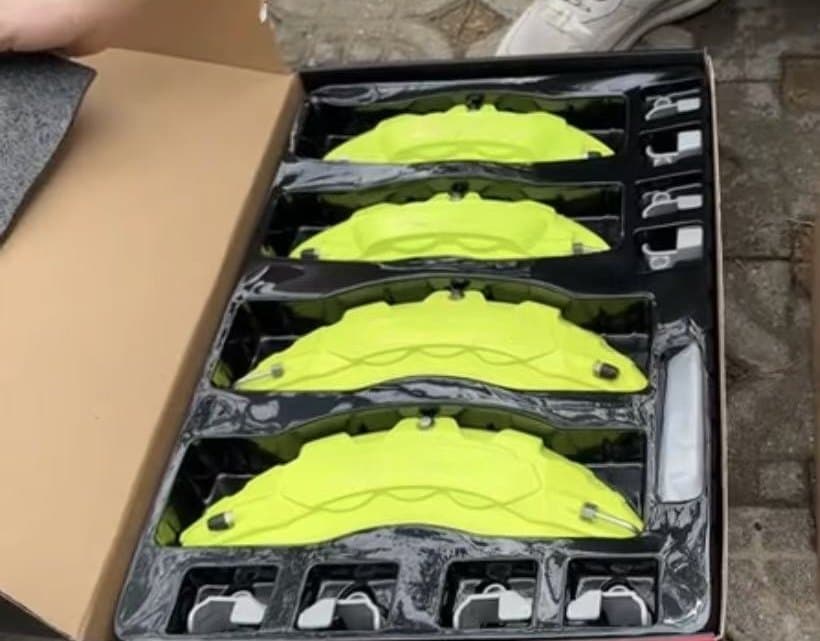Custom yellow decorative brake caliper covers with packaging