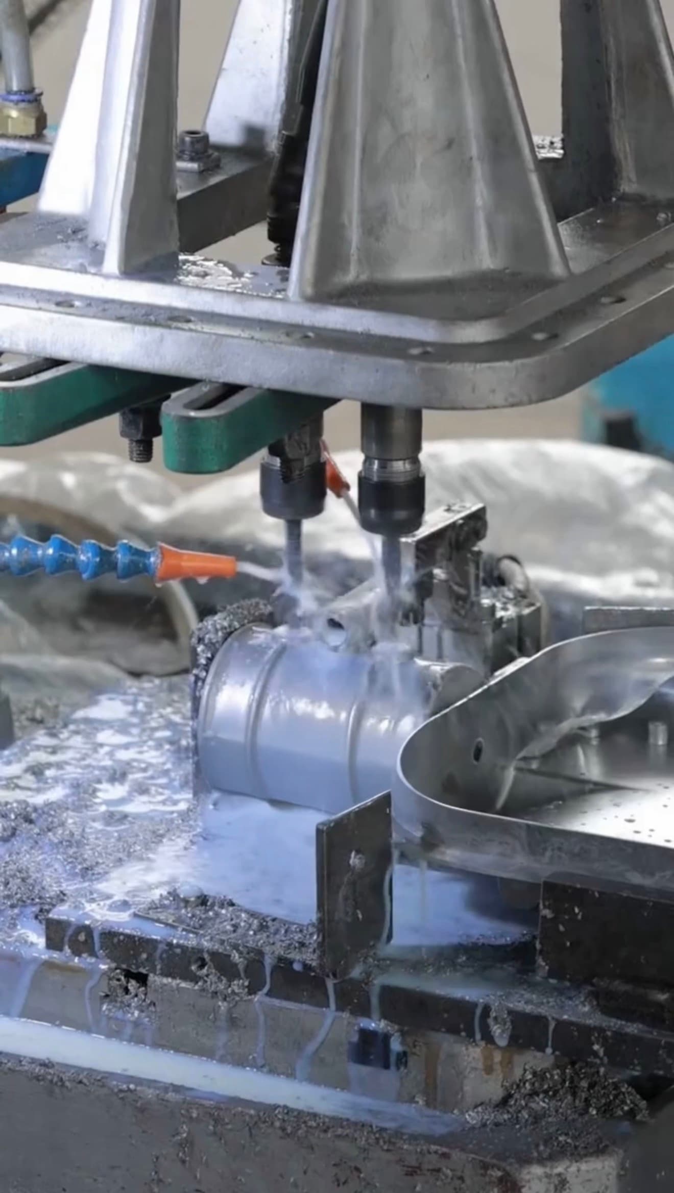Fixture-supported multi-spindle drilling and cooling for aluminum die casting parts