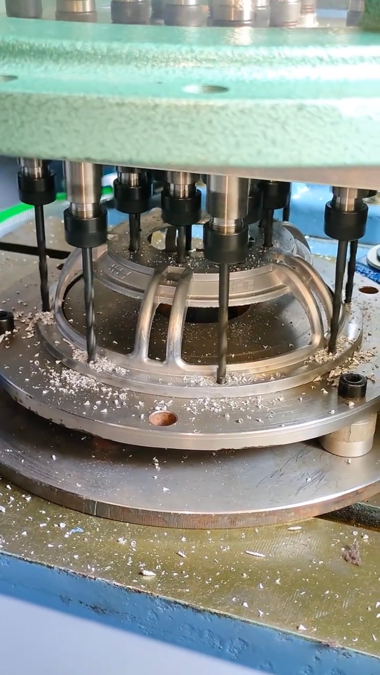 Multi-spindle drilling with product-specific fixture for aluminum die casting parts