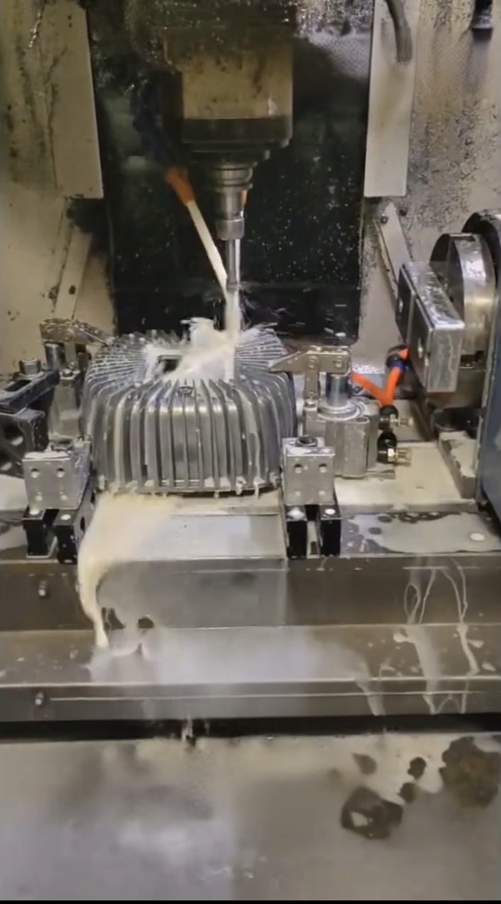 CNC machining of a clamped aluminum die cast housing