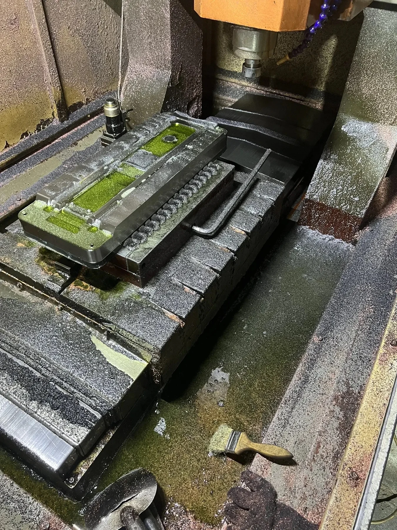 CNC machining a long metal workpiece during tooling development for the fingerprint lock panel