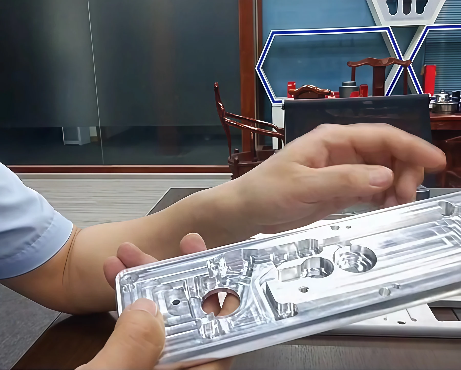 Fingerprint lock panel prototype being reviewed before production tooling