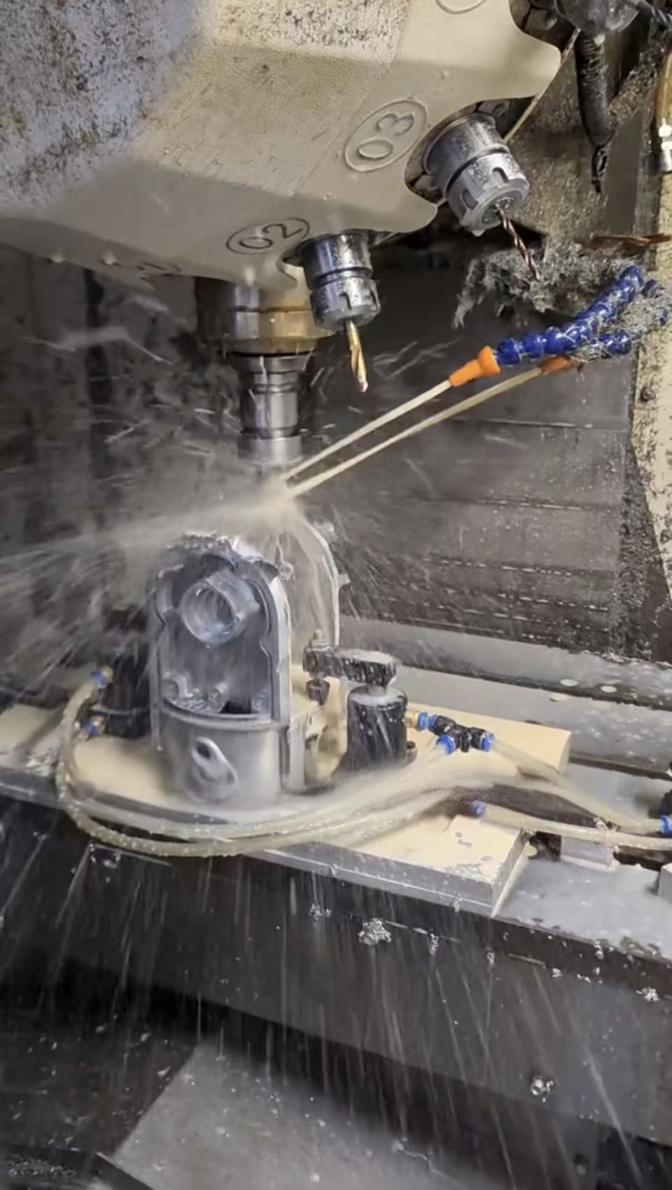 Custom aluminum cast component being machined on CNC equipment.